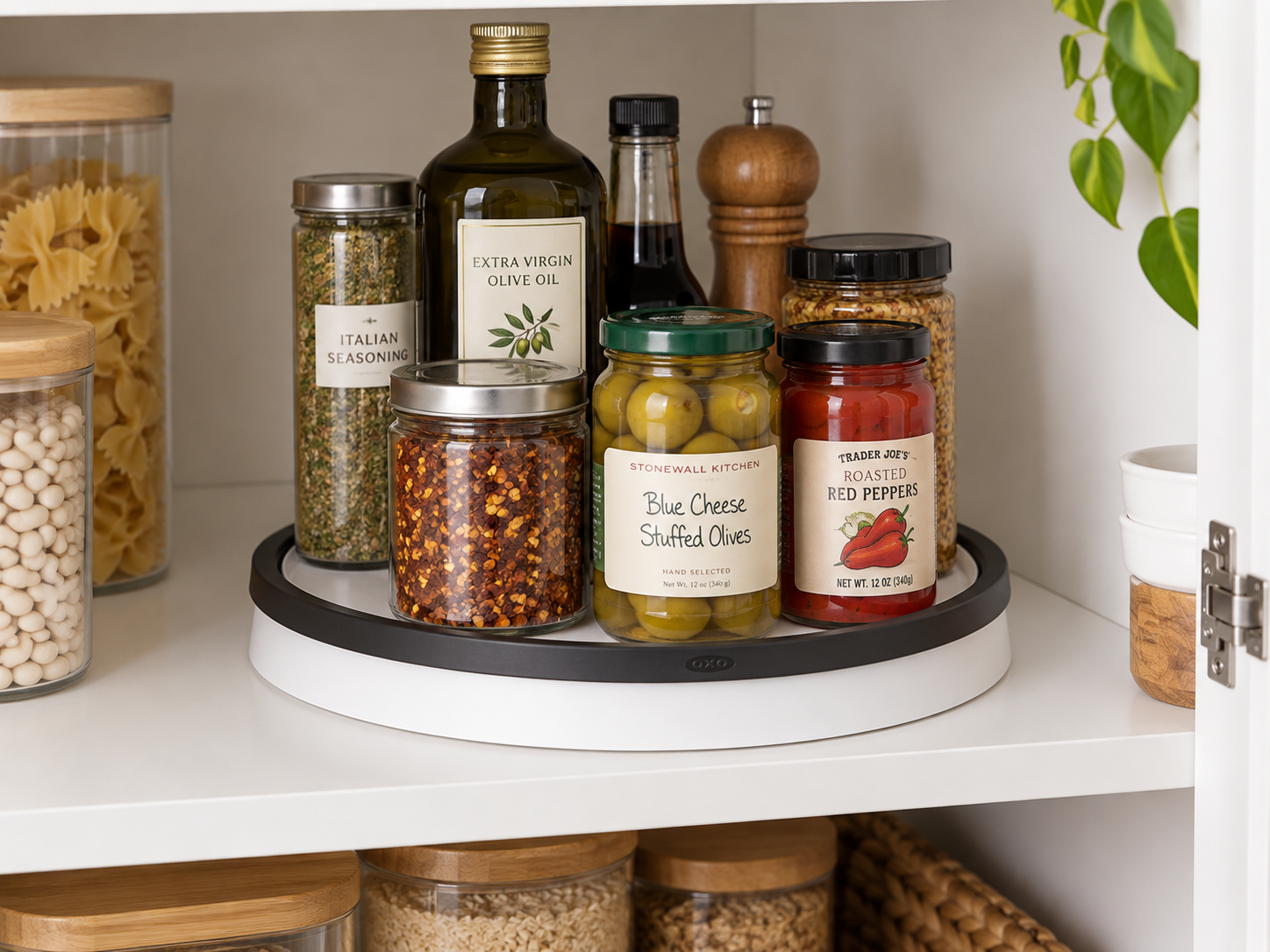 OXO Good Grips 11-inch turntable organizing bottles and jars inside a cabinet