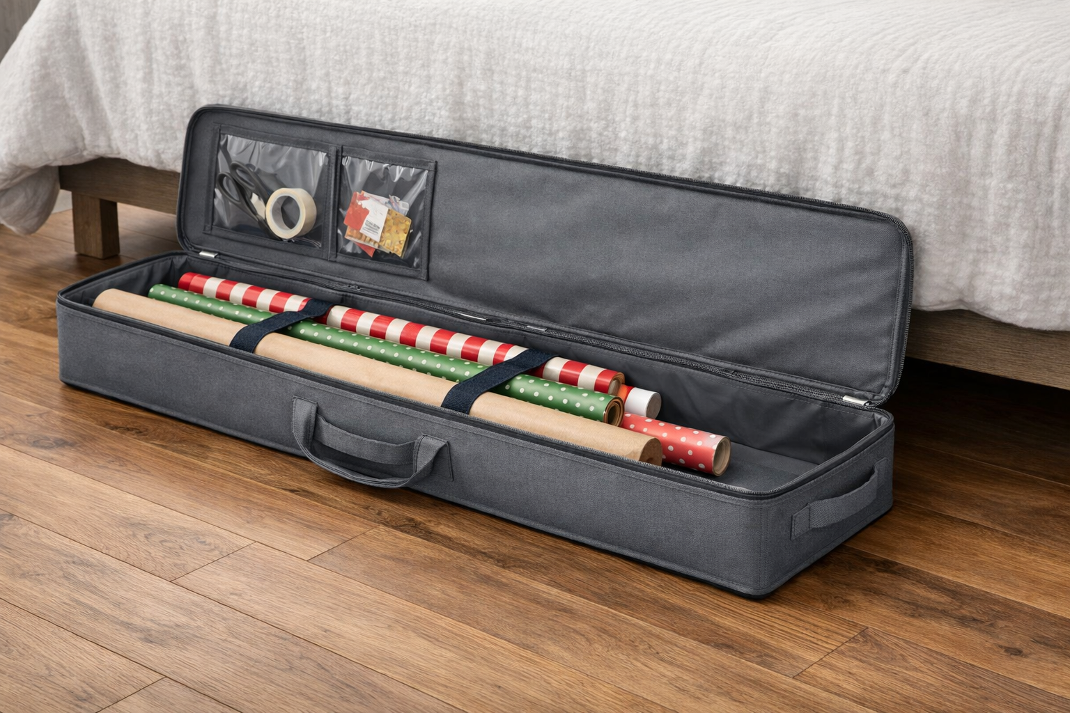 Illustration of a long, low-profile solid-gray wrapping-paper case beside an under-bed storage opening